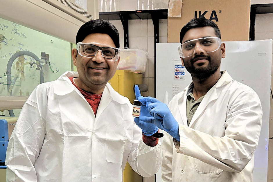 Sachin Handa and Ashish Dusunge hold AshPhos in a lab